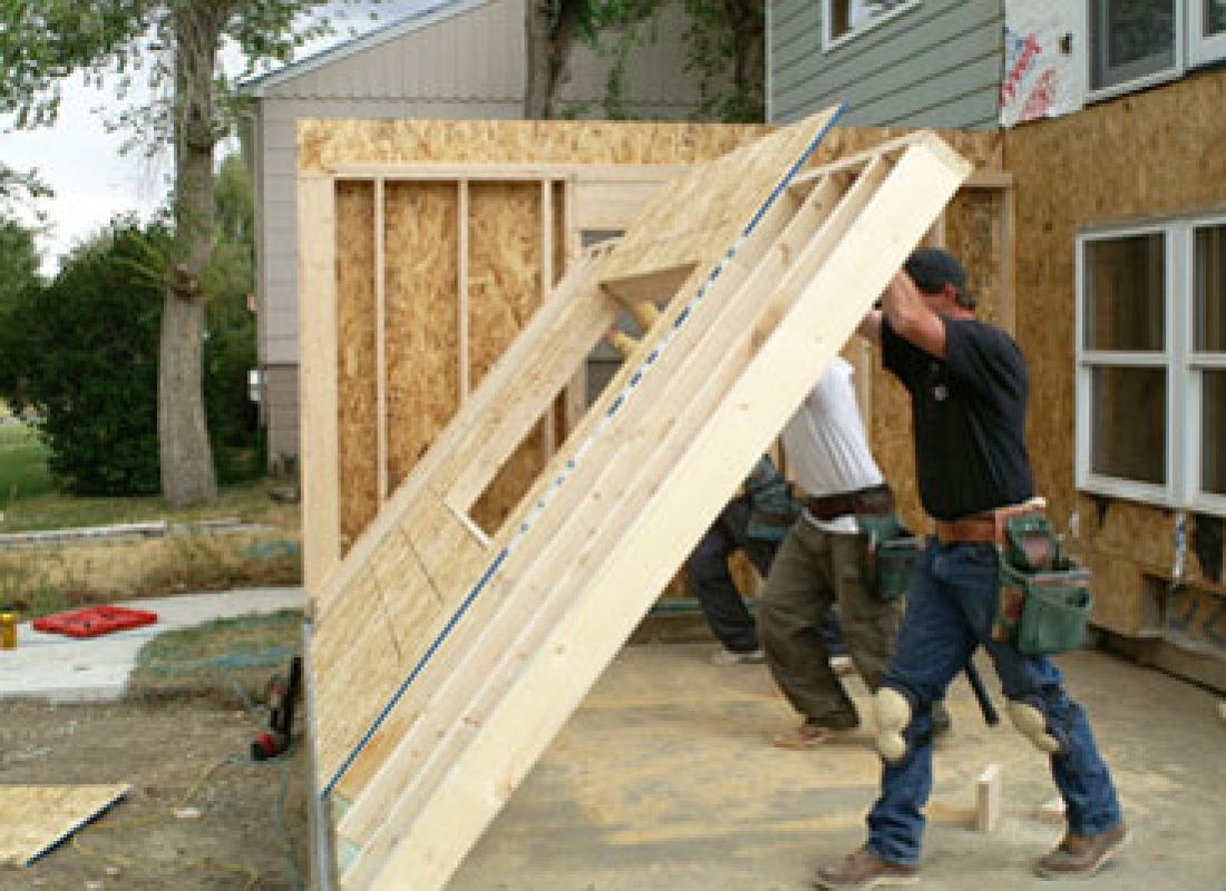 Expert ADU builders from SD Build Co discussing blueprints for a custom addition in Talmadge, CA