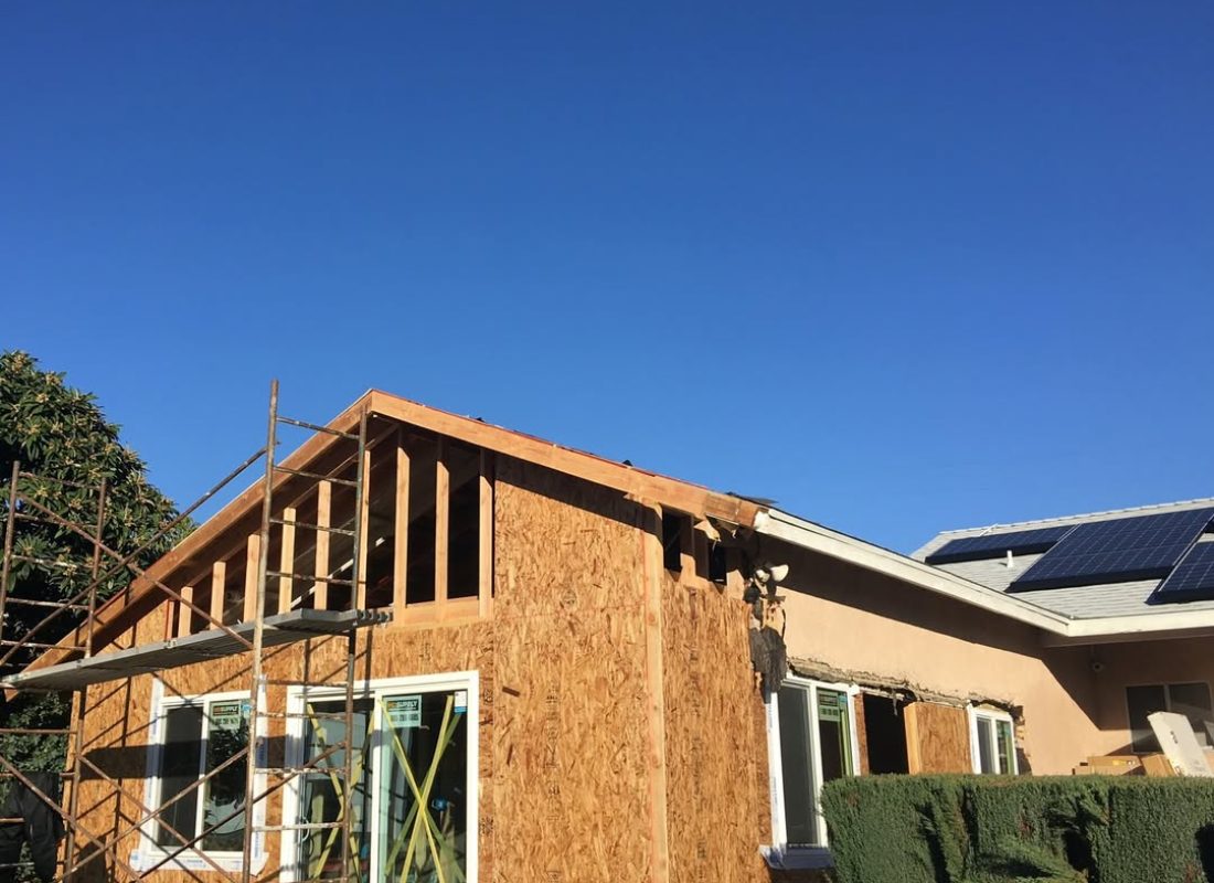 Expert ADU builders in Talmadge, CA meticulously crafting a modern, space-efficient backyard cottage